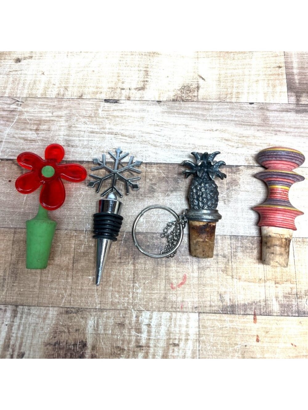 4 Unique Bottle Stoppers With Pineapple Snowflake Flower And Abstract Designs